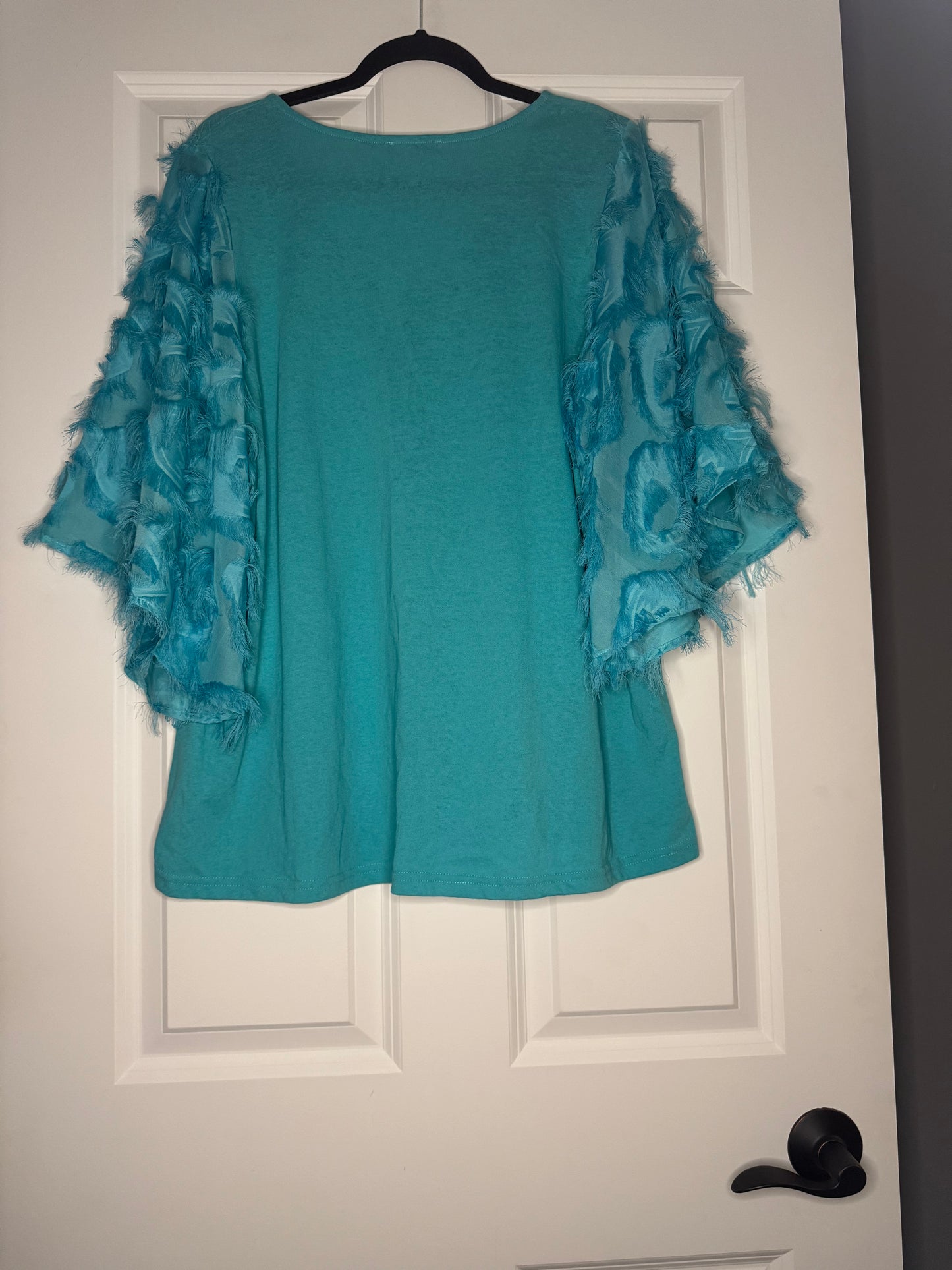 And the why half sleeve blouse green with feather sleeves 1x