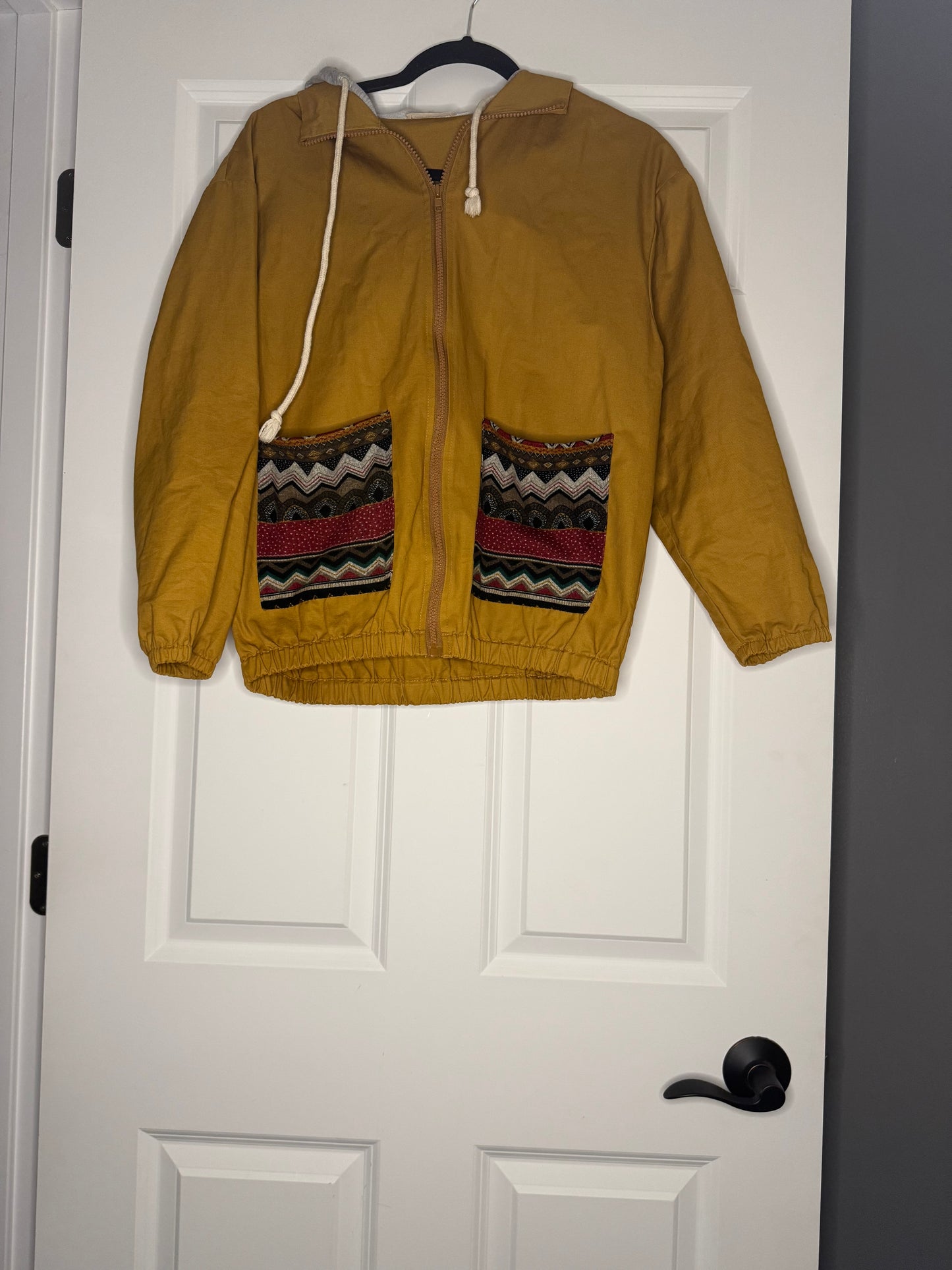 And the why jacket with hood small mustard brown w multi Aztec print pockets